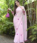Pink plain georgette saree featuring heart motifs