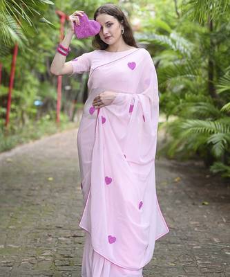 Pink plain georgette saree featuring heart motifs 2