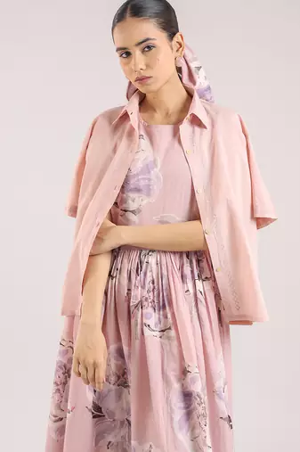 Nude pink floral printed cotton shirt dress paired with a striped slip.