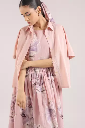 Nude pink floral printed cotton shirt dress paired with a striped slip.