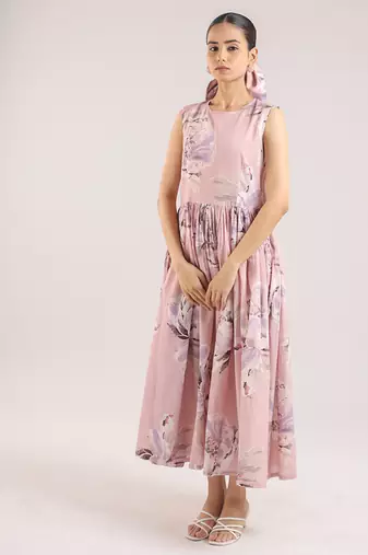 Nude pink floral printed cotton shirt dress paired with a striped slip.