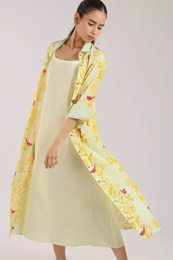 Matcha green floral printed cotton shirt dress paired with a slip.