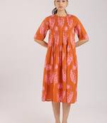 Rust orange floral printed cotton elbow sleeve dress
