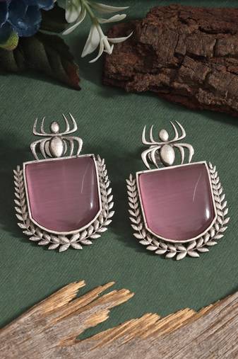Pink color oxidised earrings with engraved pattern in festive style