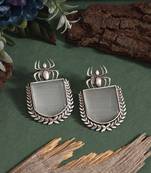 Grey color oxidised earrings featuring floral pattern with tribal touch