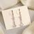 Bring vintage back with white color antique stone earrings in style