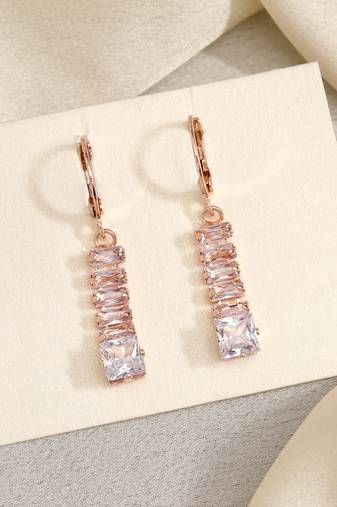 Glowing in elegance: white color antique stone earrings with lush finish