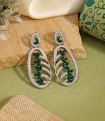 Green color fashion earrings with leaf-inspired elegant jewelry design theme