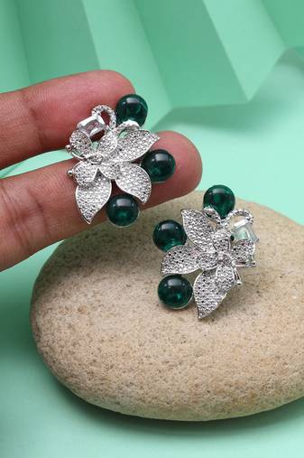 Green color fashion earrings that add color to monochrome outfits