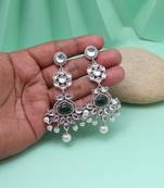 Green color fashion earrings offering stylish vibrance with natural tones