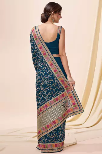 Trendmalls teal Vichitra silk blend embroidered swarovski work saree with unstitched blouse