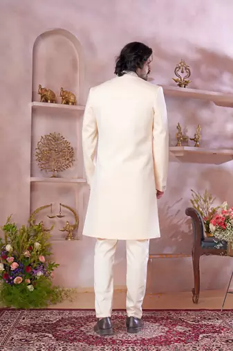cream imported plain fabric sherwani with faux satin churidar foe men