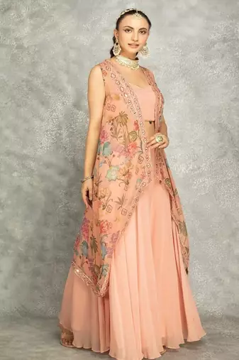 Peach lehenga with embroidered cape and crop top bustier