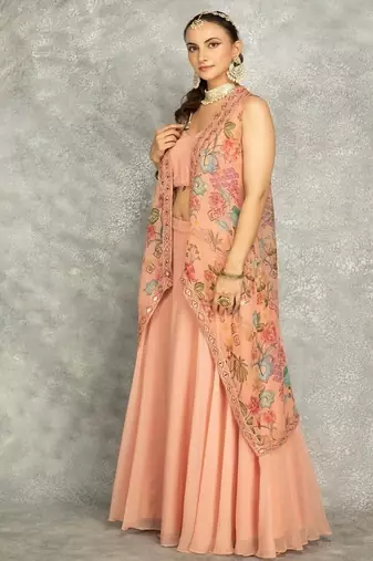Peach lehenga with embroidered cape and crop top bustier