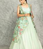 Turquoise lehenga with embroidered cape and crop top bustier