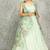 Turquoise lehenga with embroidered cape and crop top bustier