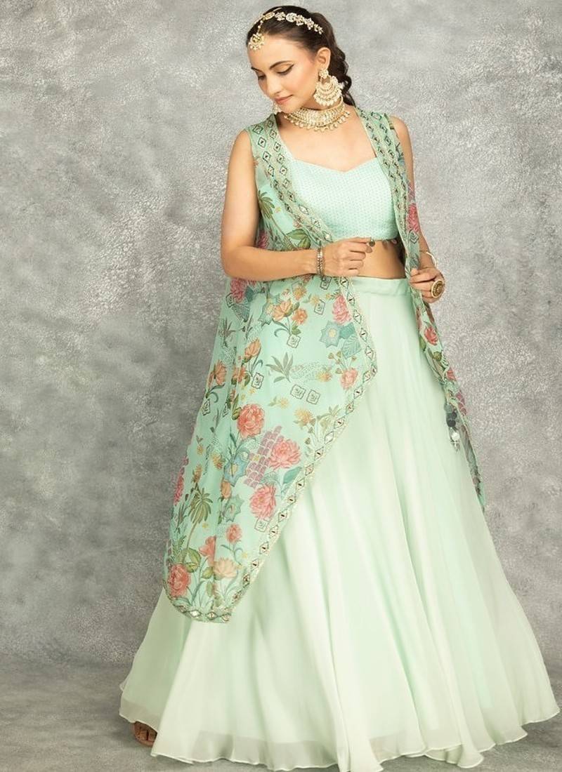 Turquoise lehenga with embroidered cape and crop top bustier