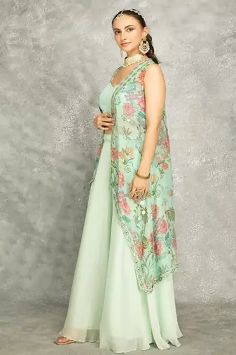 Turquoise lehenga with embroidered cape and crop top bustier