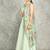 Turquoise lehenga with embroidered cape and crop top bustier