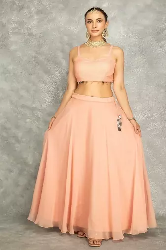 Peach lehenga with embroidered cape and crop top bustier