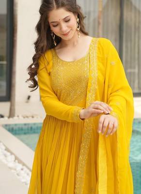 Yellow faux blooming with embroidery zari sequins work gown 4