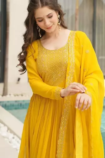 Yellow faux blooming with embroidery zari sequins work gown