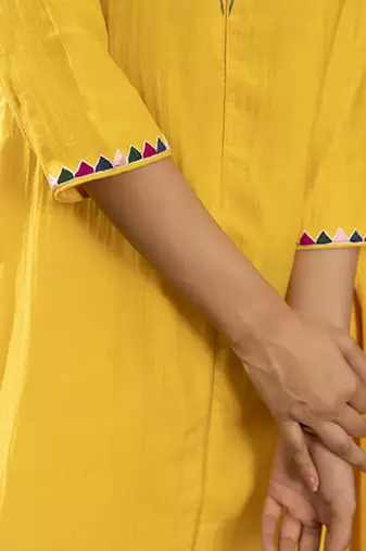 Yellow chanderi silk plain kurta and pant with neck embroidery