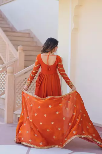 Orange color fendy chiffon fabric elegant embroidered gown with dupatta