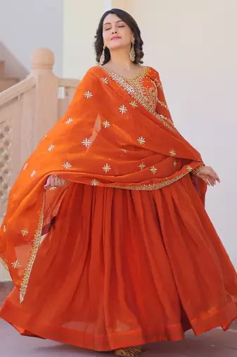 Orange color fendy chiffon fabric elegant embroidered gown with dupatta