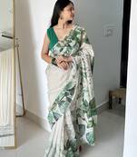 Green tropical printed soft linen saree with handmade tassels and printed blouse