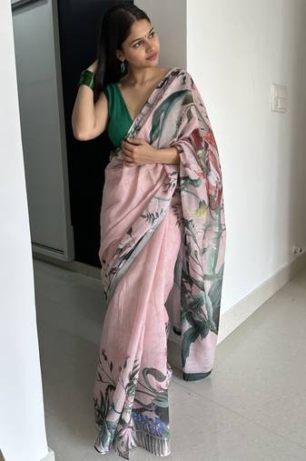 Light pink tropical printed soft linen saree with handmade tassels and printed blouse