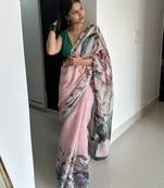 Light pink tropical printed soft linen saree with handmade tassels and printed blouse