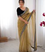 Beige twill net saree