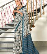 Turquoise printed cotton saree with blouse piece