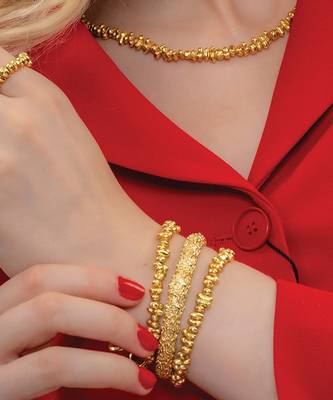 Gold finished dune bangles 1