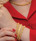 Gold finished dune bangles