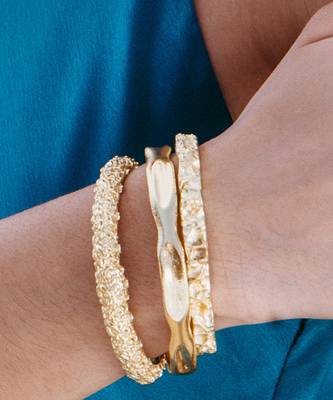 Gold finished dune bangles 5
