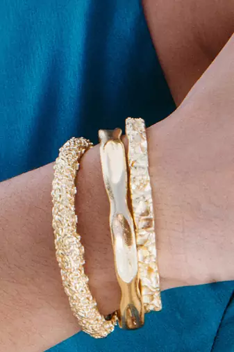 Gold finished dune bangles