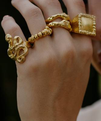 Gold finished twist of fate ring 1