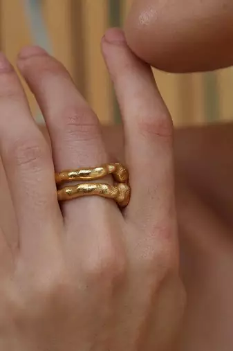 Gold finished twist of fate ring