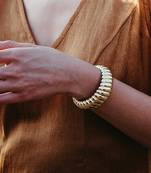 Gold finished twisted tide cuff