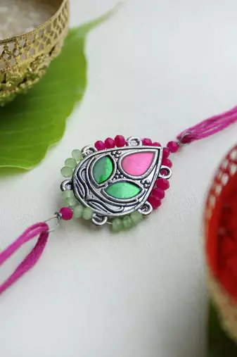 Regal blossom vivid vintage rakhi with roli chawal