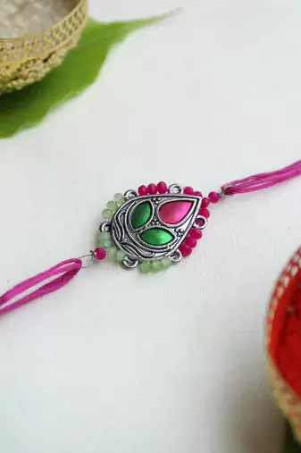 Regal blossom vivid vintage rakhi with roli chawal