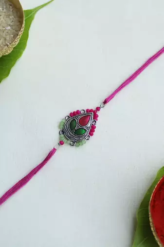 Regal blossom vivid vintage rakhi with roli chawal