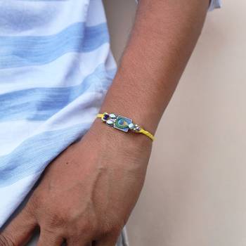 Mor pankh vivid vintage rakhi with roli chawal 4