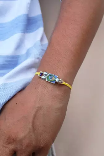 Mor pankh vivid vintage rakhi with roli chawal
