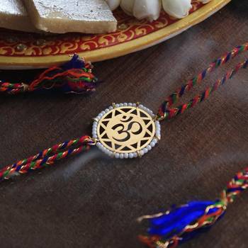 golden beaded om rakhi with roli chawal 2
