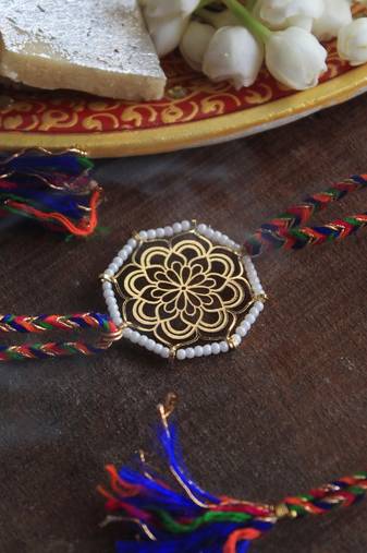 Golden beaded mandala rakhi with roli chawal