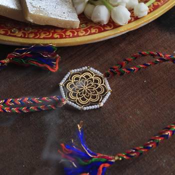 Golden beaded mandala rakhi with roli chawal 2