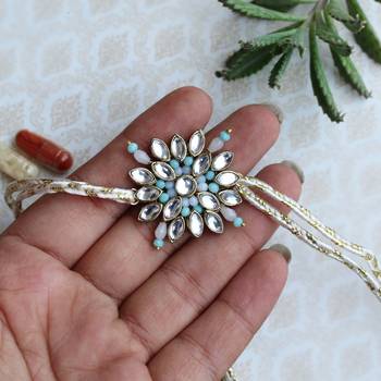 Blossoming kundan and bead work rakhi with roli chawal 1